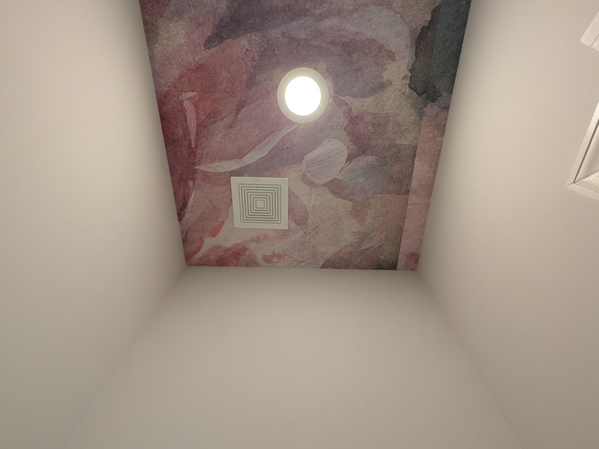 Bathroom — watercolour mural papered across the ceiling