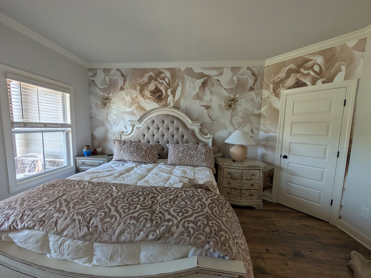 Bedroom — oversized peony mural carried across two walls