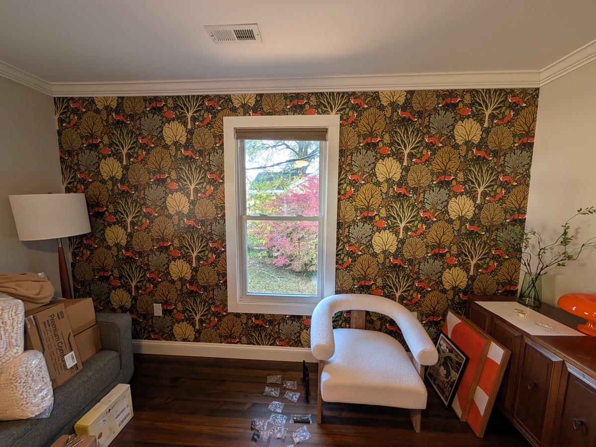 Bedroom — dark woodland paper with foxes, hung around the window