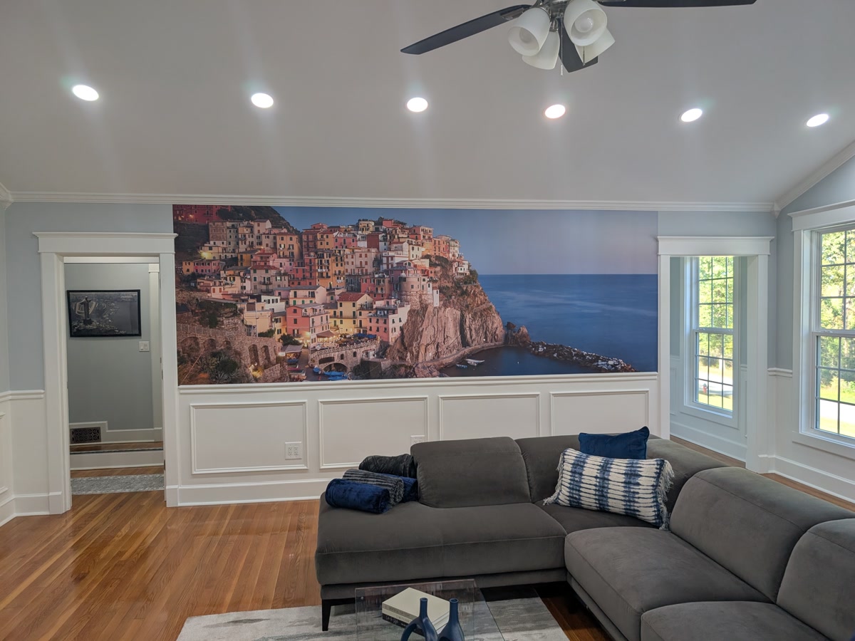Living room — six-panel Cinque Terre photo mural above wainscot