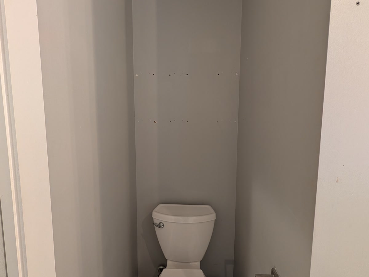 Before — Powder room under the stairs